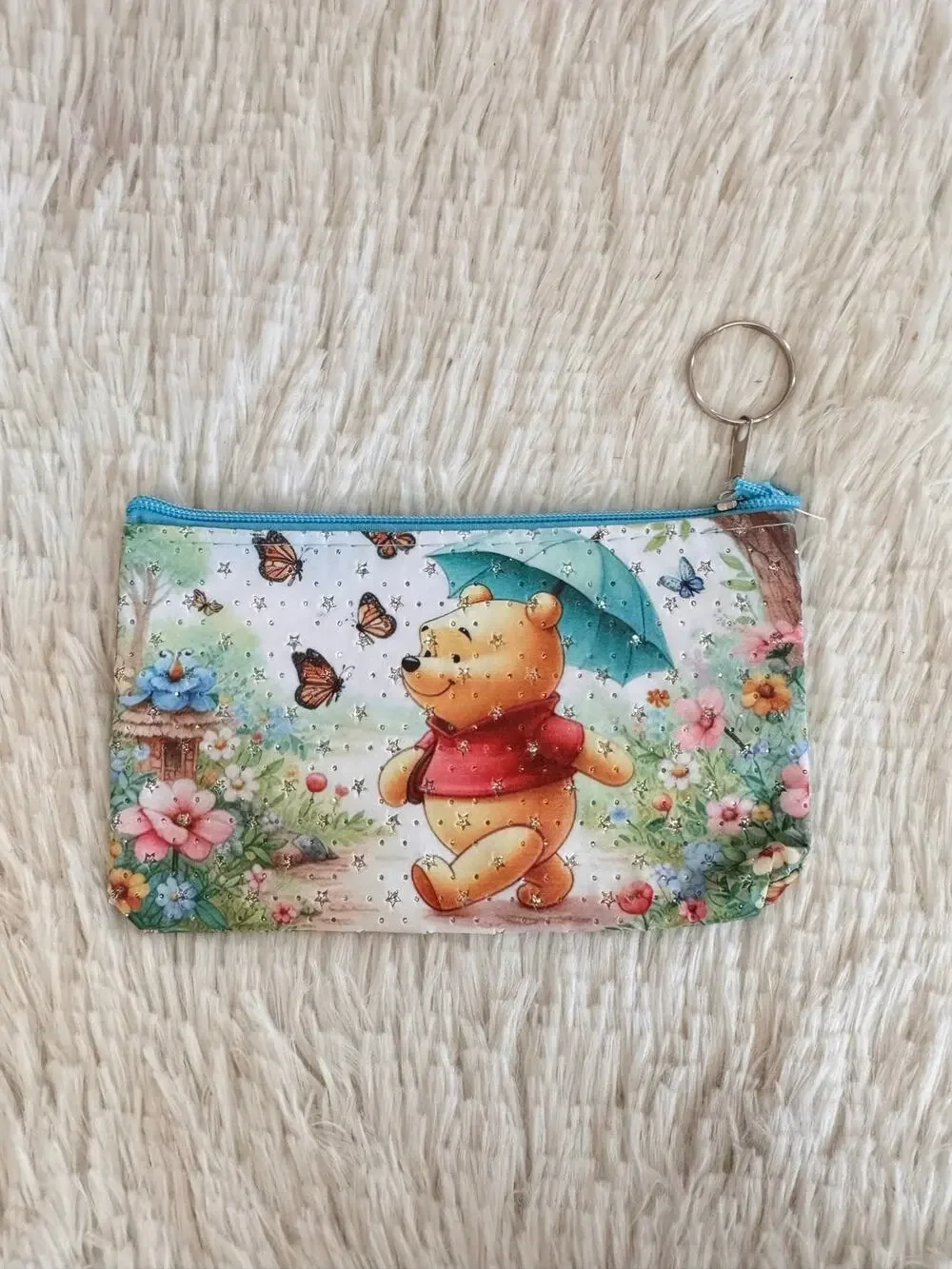 Winnie the Pooh pencil case Pooh holding an umbrella surrounded by butterflies